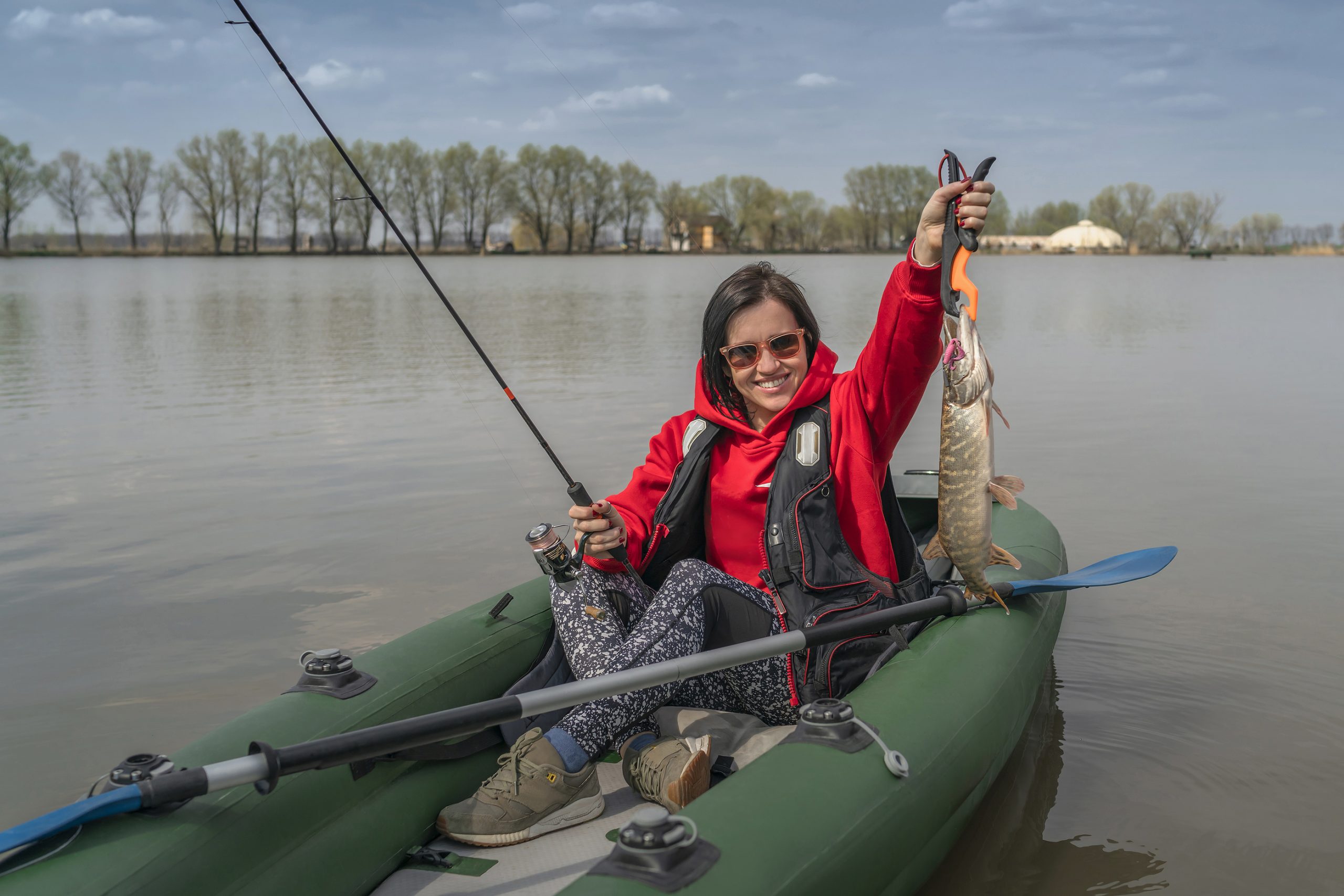 Fisher Girl Holding Pike Fish